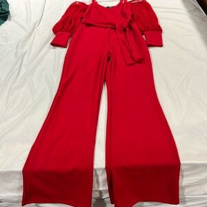 Red Jumpsuit size Medium, sleeves are sheer.